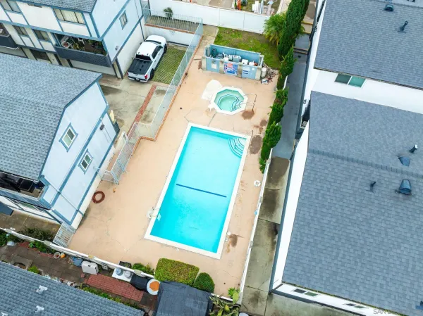 an aerial view of a city with streets and houses