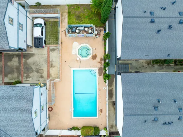 an aerial view of a residential apartment building with a yard