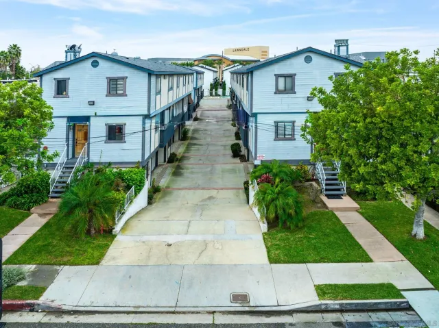 an aerial view of a city with streets and houses