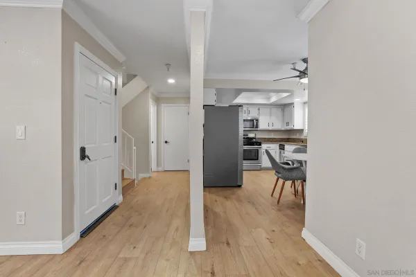 a view of a kitchen with wooden floor