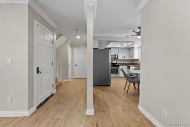 a view of a kitchen with wooden floor