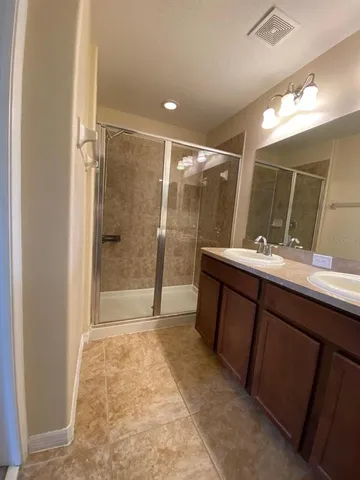 an empty room with a empty space and windows