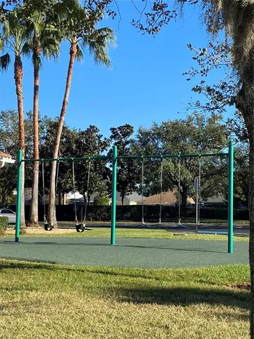 a view of a park with large trees