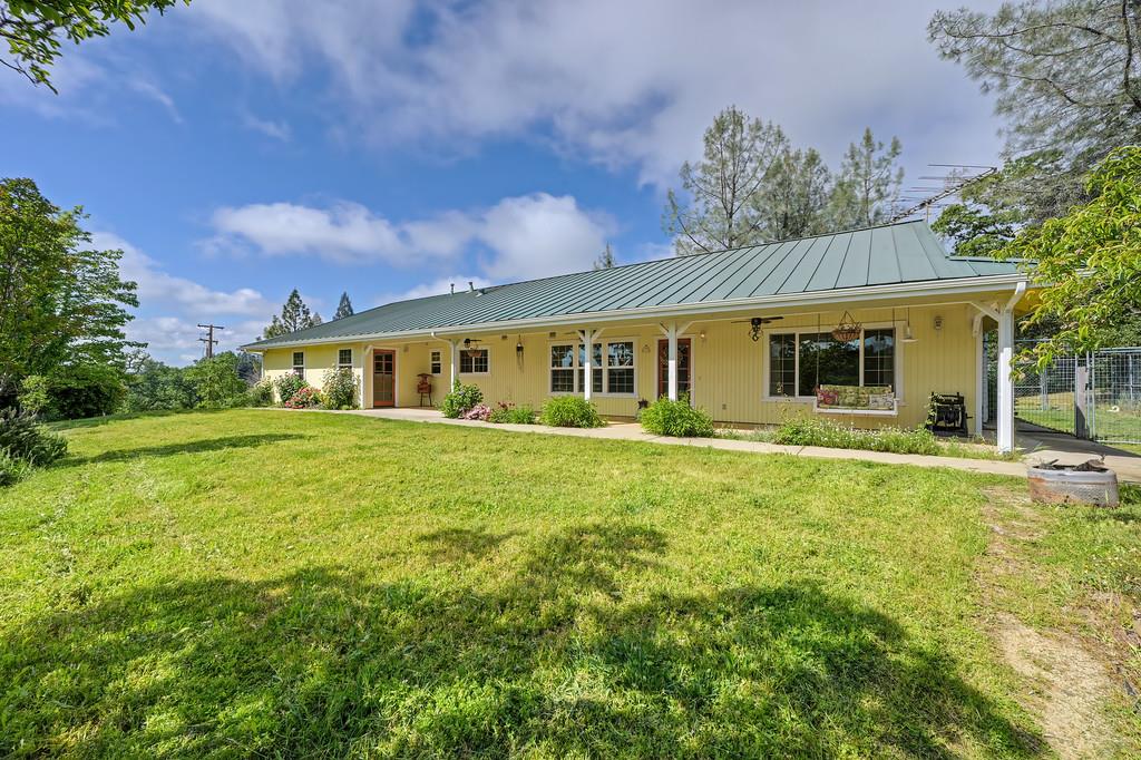 6181 Lambert Lane El Dorado, CA 95623 - Photo 11 of 80 a front view of a house with a garden