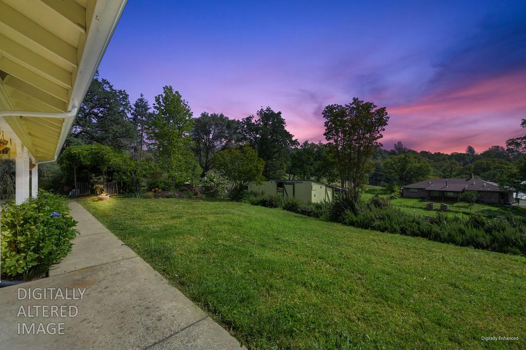 6181 Lambert Lane El Dorado, CA 95623 - Photo 15 of 80 yard at dusk with a storage unit