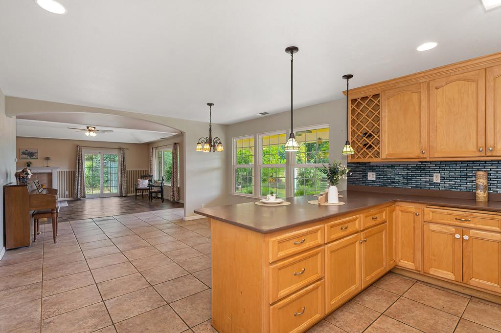 6181 Lambert Lane El Dorado, CA 95623 - Photo 77 of 80 a kitchen with sink cabinets and window