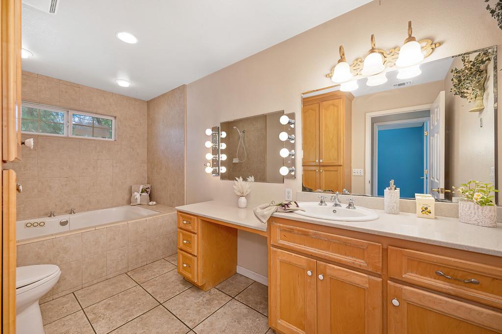 6181 Lambert Lane El Dorado, CA 95623 - Photo 35 of 80 full bathroom with vanity, a garden tub, light tile patterned floors, and a tile shower