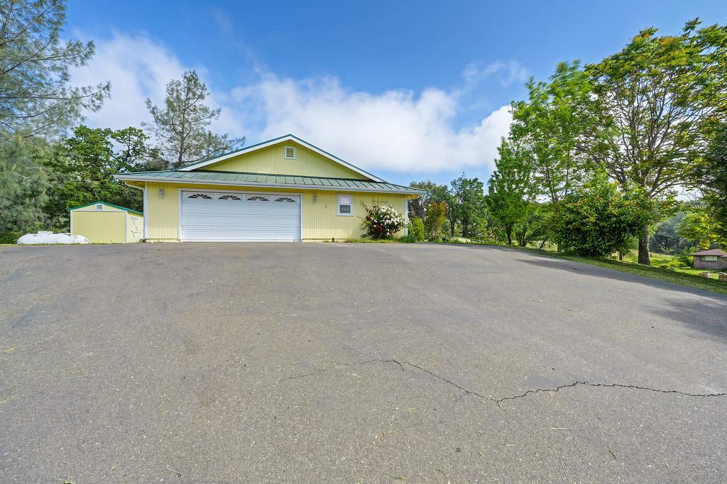 6181 Lambert Lane El Dorado, CA 95623 - Photo 4 of 80 a view of a house with a yard and large tree