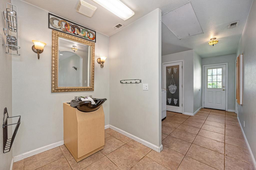 6181 Lambert Lane El Dorado, CA 95623 - Photo 48 of 80 foyer entrance with baseboards and light tile patterned floors