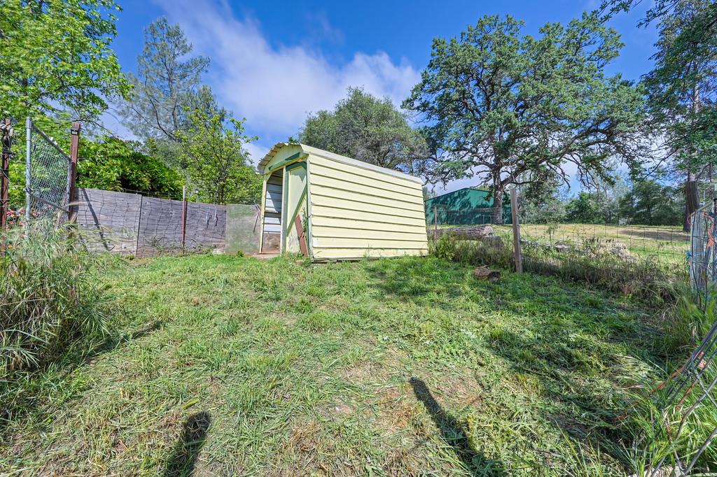 6181 Lambert Lane El Dorado, CA 95623 - Photo 67 of 80 fenced backyard featuring a shed