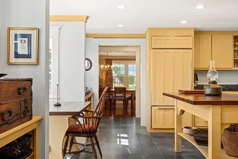 a kitchen with stainless steel appliances granite countertop a sink and cabinets