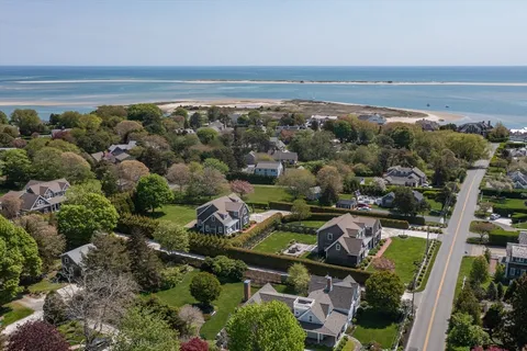 an aerial view of multiple house with outdoor space