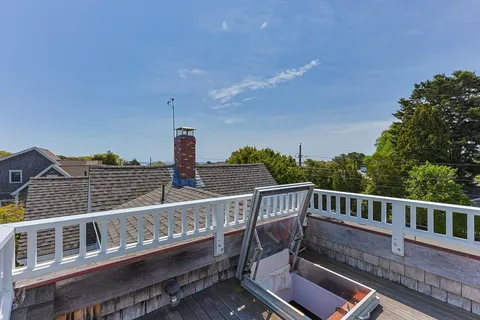 a view of balcony with furniture