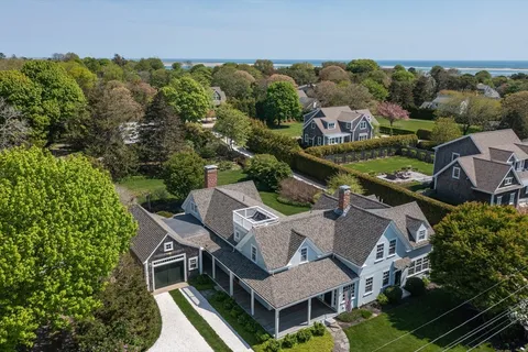 an aerial view of a house with a garden