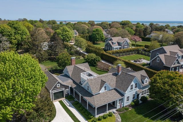 an aerial view of a house with a garden