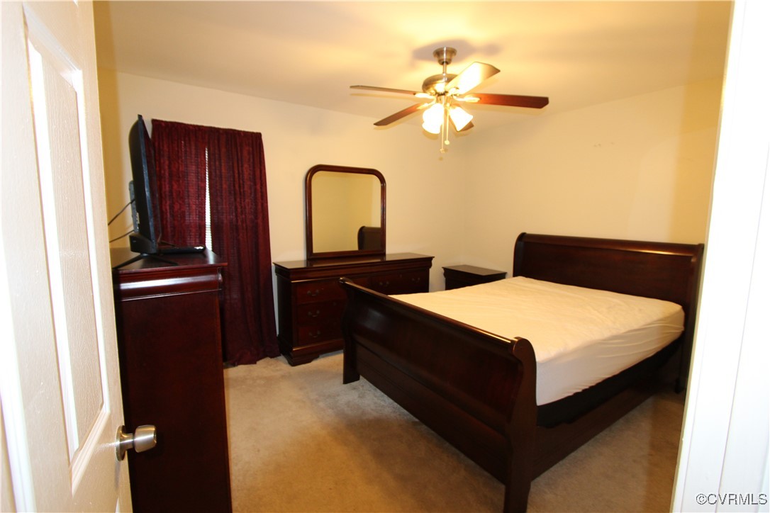 4849 Wilconna Road Chesterfield, VA 23832 - Photo 4 of 8 a bedroom with a bed and cabinets