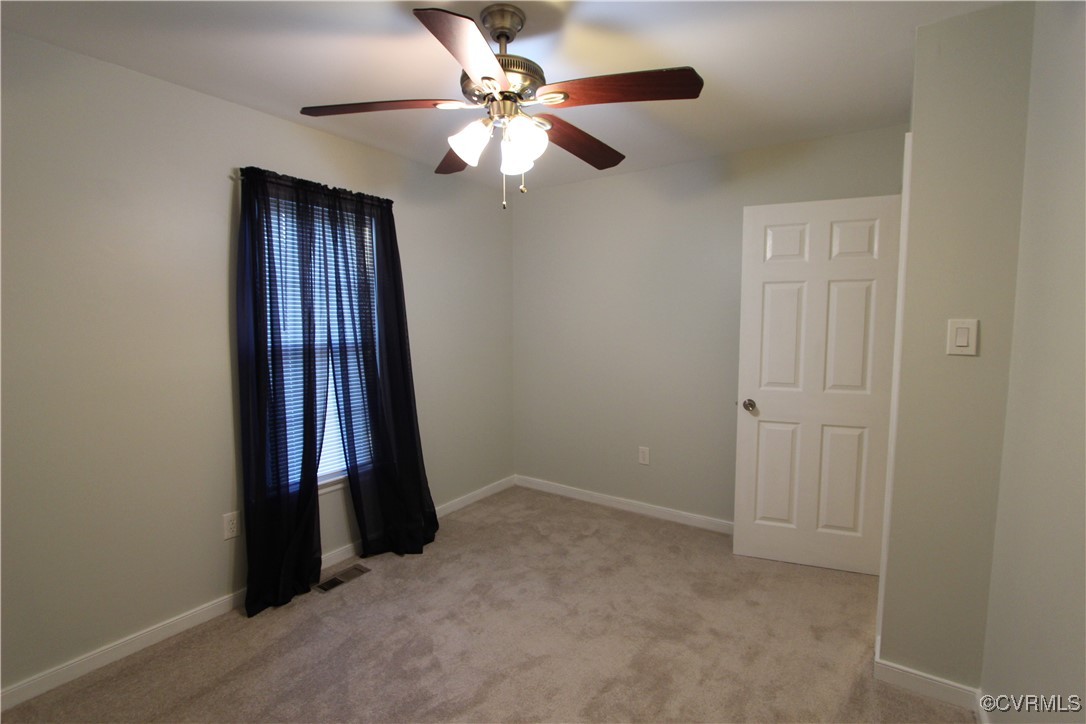 4849 Wilconna Road Chesterfield, VA 23832 - Photo 5 of 8 an empty room with fan and windows