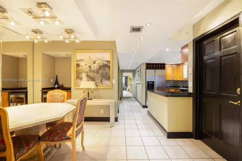a large kitchen with a table and chairs
