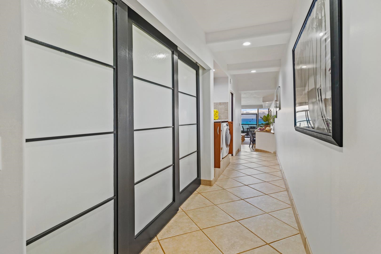 3875 Lower Honoapiilani Road, Unit B305 Lahaina, HI 96761 - Photo 35 of 35 a hallway with sliding door and stairs