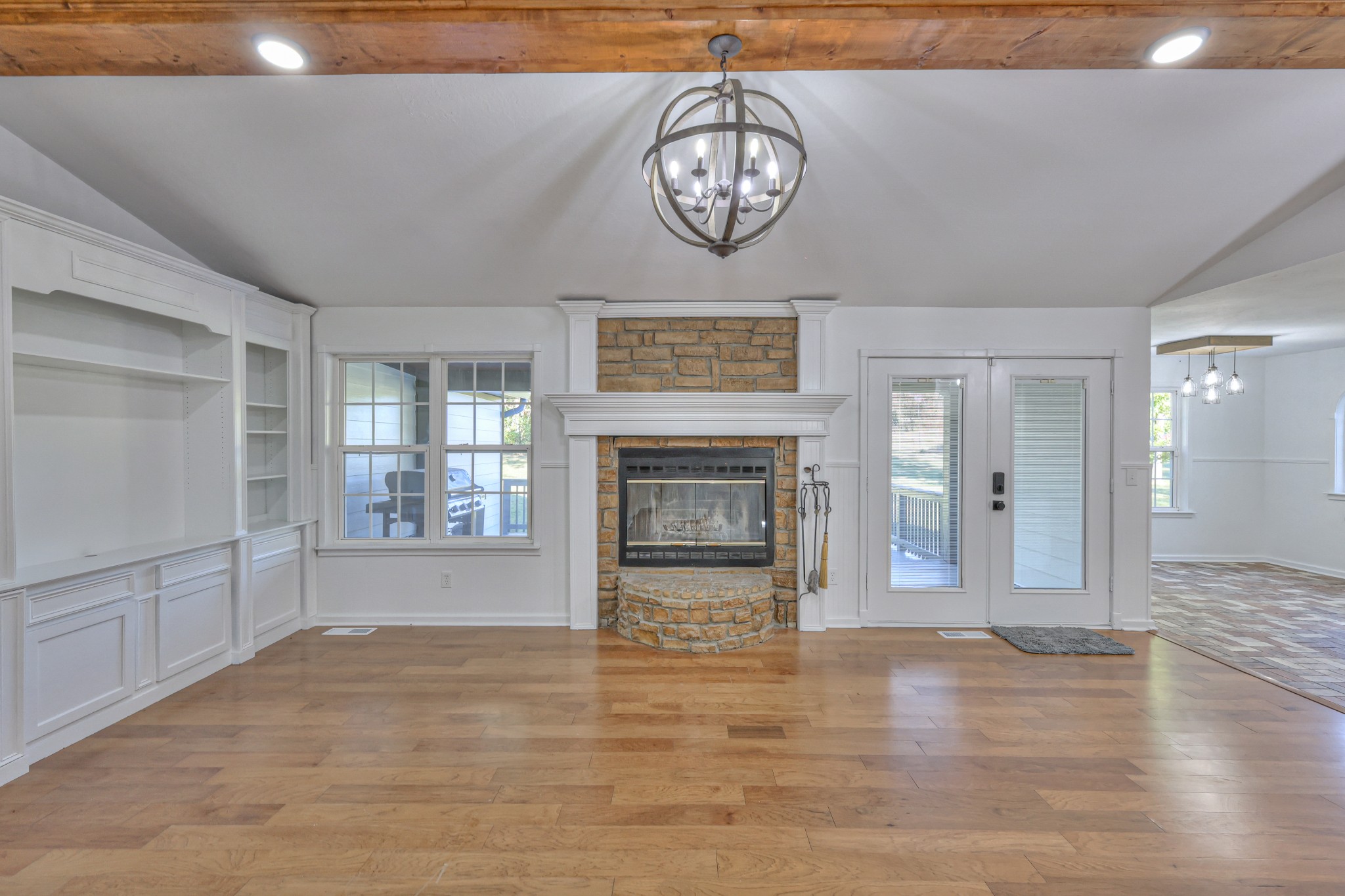 1380 Haley Road Watertown, TN 37184 - Photo 11 of 95 a view of a livingroom with a fireplace a chandelier and wooden floor