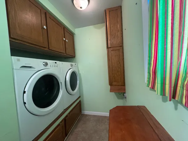 a view of a kitchen with washer and dryer