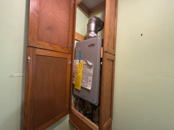 a view of a kitchen from a hallway