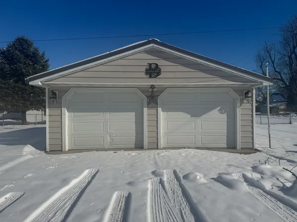 a front view of a house with a garage