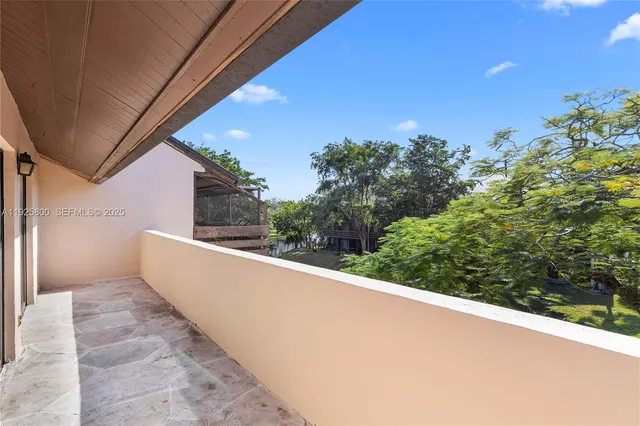 a view of a swimming pool with lounge chairs