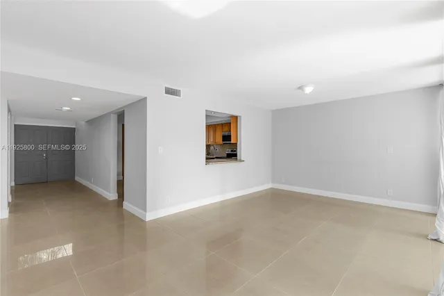 an empty room with a bathroom