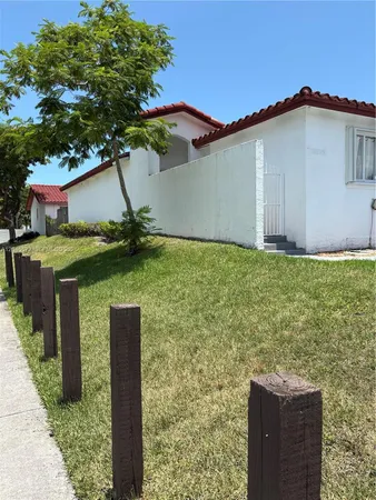 a house that has tree in front of it