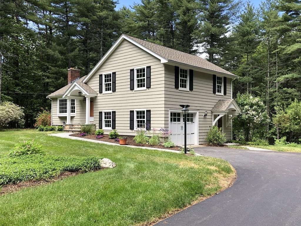 175 Powers Road Sudbury, MA 01776 - Photo 1 of 32 a view of a house with a yard and sitting area