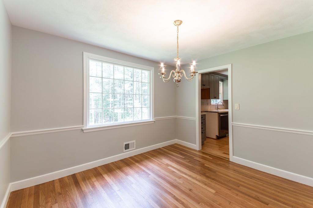 175 Powers Road Sudbury, MA 01776 - Photo 11 of 32 a view of empty room with wooden floor and window