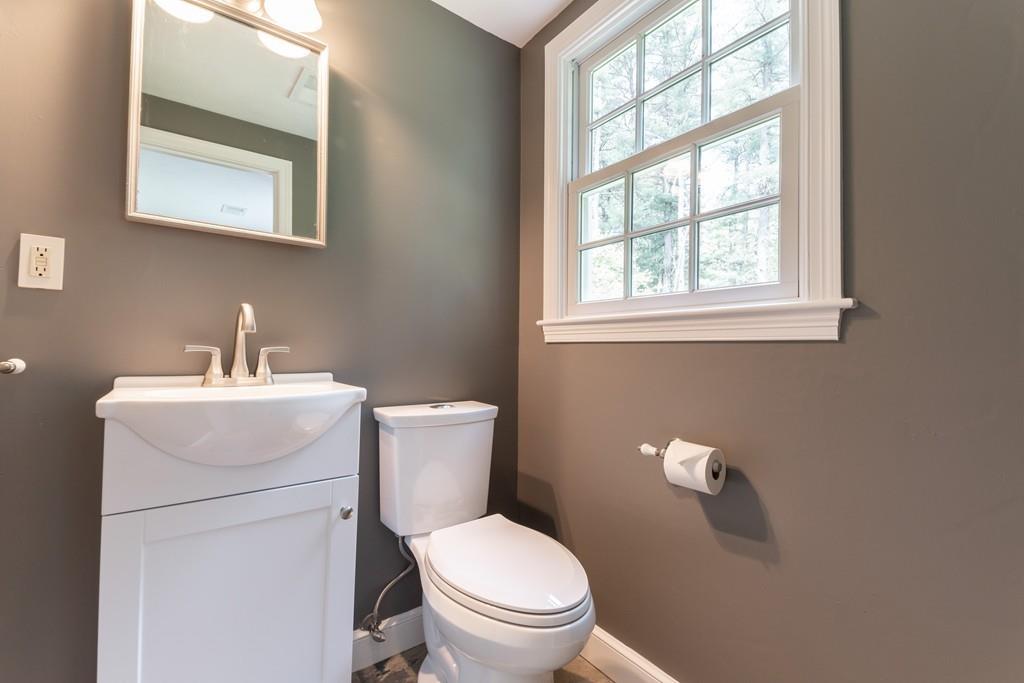 175 Powers Road Sudbury, MA 01776 - Photo 19 of 32 a white toilet sitting next to a bathroom sink