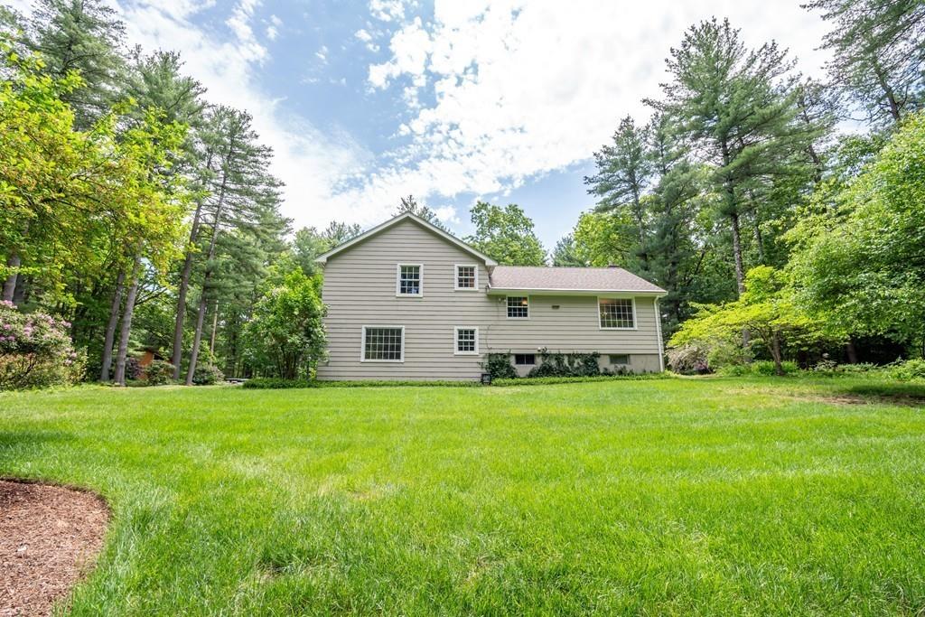 175 Powers Road Sudbury, MA 01776 - Photo 28 of 32 a view of a house with a yard