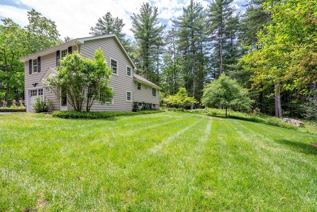 175 Powers Road Sudbury, MA 01776 - Photo 30 of 32 a view of a house with a yard