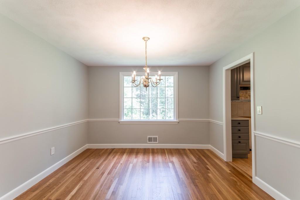 175 Powers Road Sudbury, MA 01776 - Photo 10 of 32 wooden floor in an empty room with a window