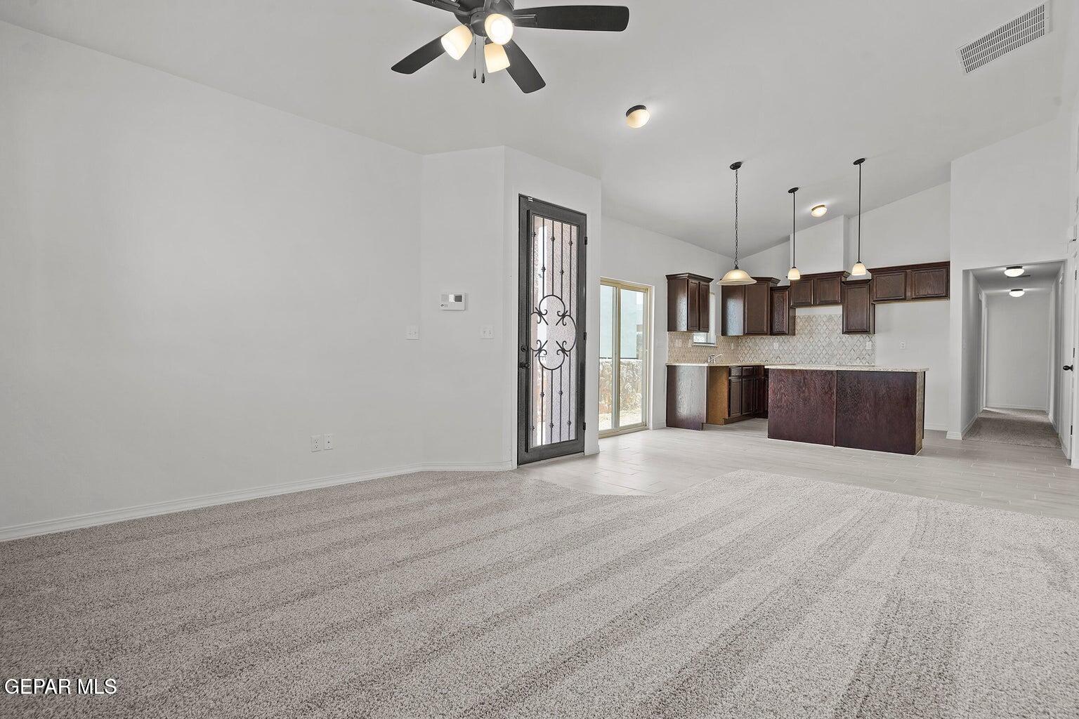 257 Farnborough Street El Paso, TX 79928 - Photo 14 of 34 a view of a kitchen with furniture and a ceiling fan