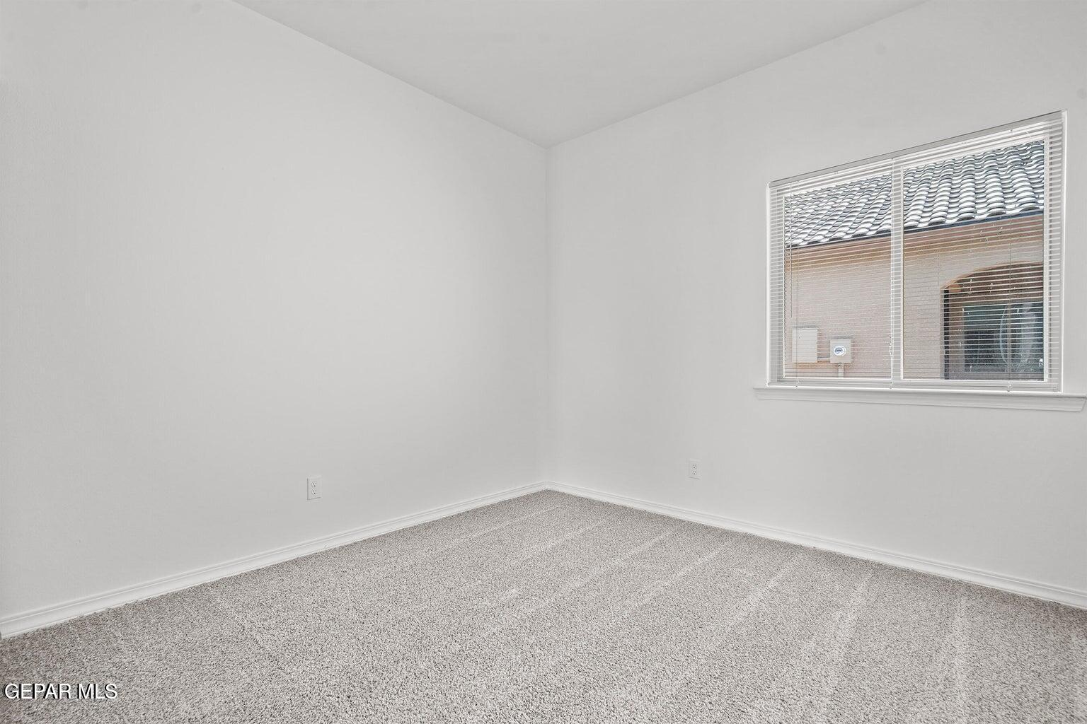 257 Farnborough Street El Paso, TX 79928 - Photo 15 of 34 an empty room with a window