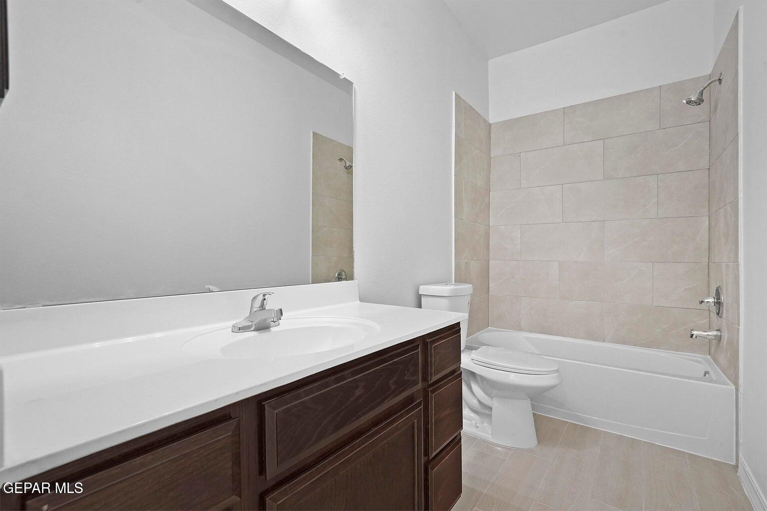 257 Farnborough Street El Paso, TX 79928 - Photo 16 of 34 a bathroom with a sink a toilet and shower