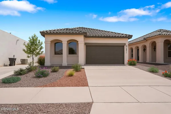 a front view of a house with garage