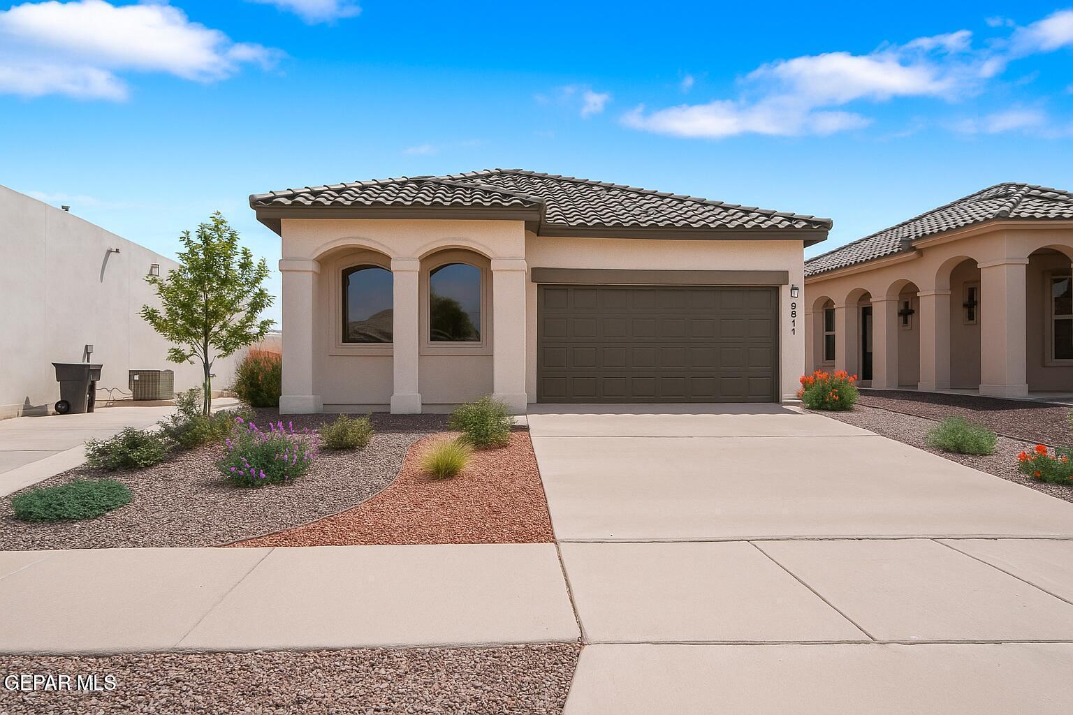 257 Farnborough Street El Paso, TX 79928 - Photo 2 of 34 a front view of a house with garage