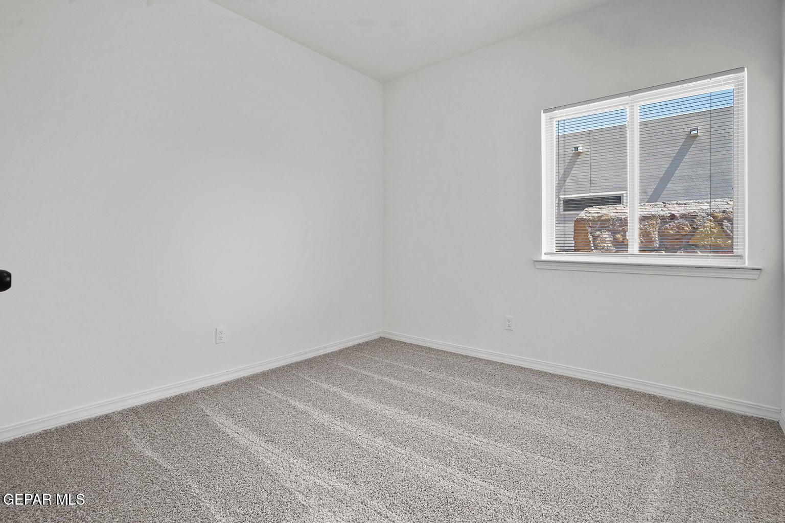 257 Farnborough Street El Paso, TX 79928 - Photo 23 of 34 an empty room with a window