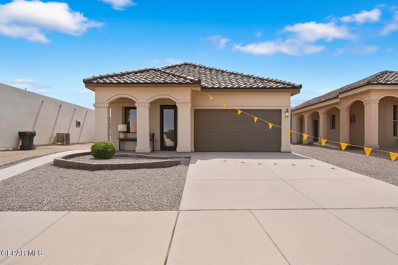 257 Farnborough Street El Paso, TX 79928 - Photo 3 of 34 a view of a house with potted plants