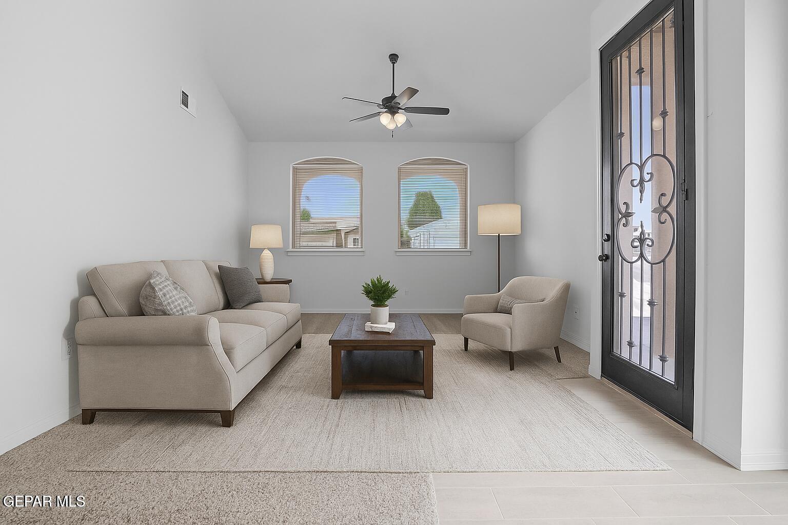 257 Farnborough Street El Paso, TX 79928 - Photo 6 of 34 a living room with furniture and a chandelier
