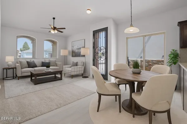 a living room with furniture and a chandelier