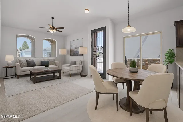 a living room with furniture and a chandelier