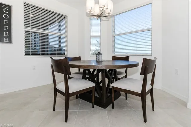 a view of a dining room with furniture and window
