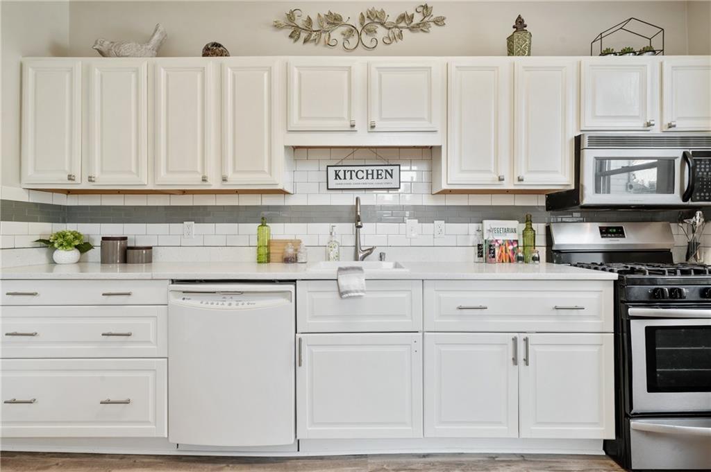 1908 Middle Street Pittsburgh, PA 15215 - Photo 12 of 30 Crisp white cabinets, stainless steel hardware, a new pulldown sprayer faucet and updated appliances