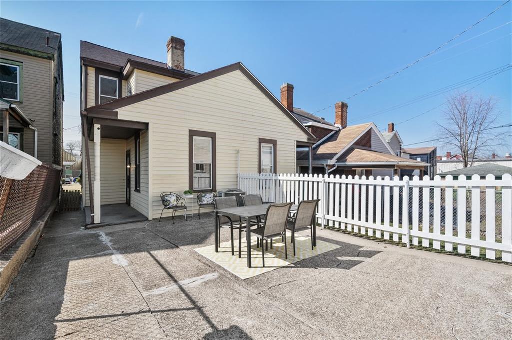 1908 Middle Street Pittsburgh, PA 15215 - Photo 25 of 30 The low-maintenance, fenced rear yard offers space for recreation and al fresco dining.