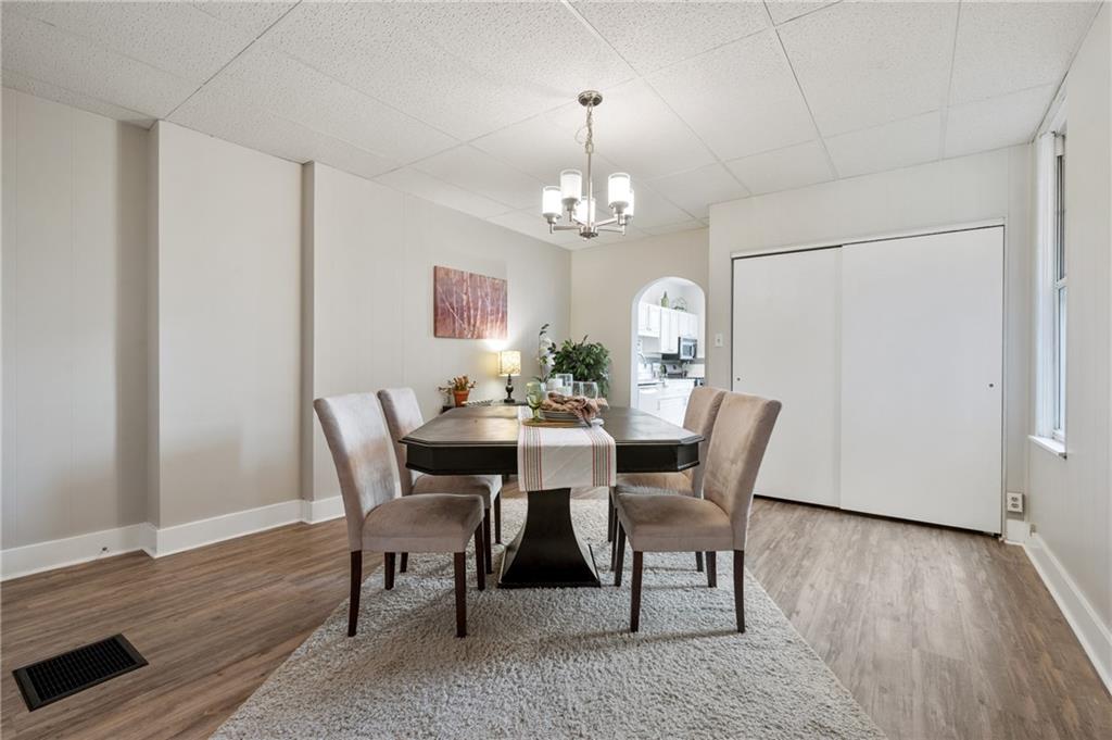 1908 Middle Street Pittsburgh, PA 15215 - Photo 8 of 30 Super spacious dining room -- the perfect setting for hosting memorable holiday parties or family dinners! Note the large lighted closet at the end of the dining room